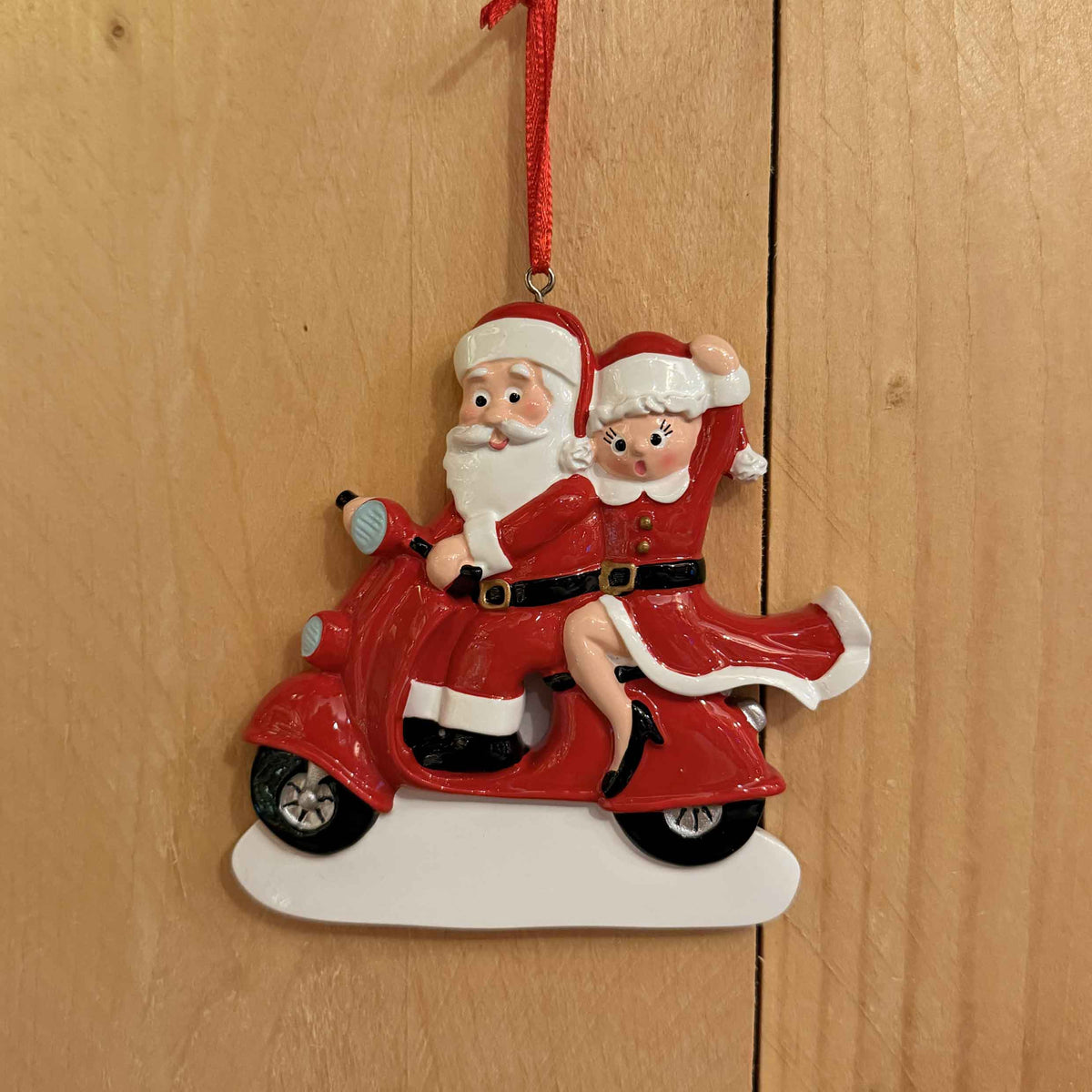 Mamma e Babbo Natale in vespa