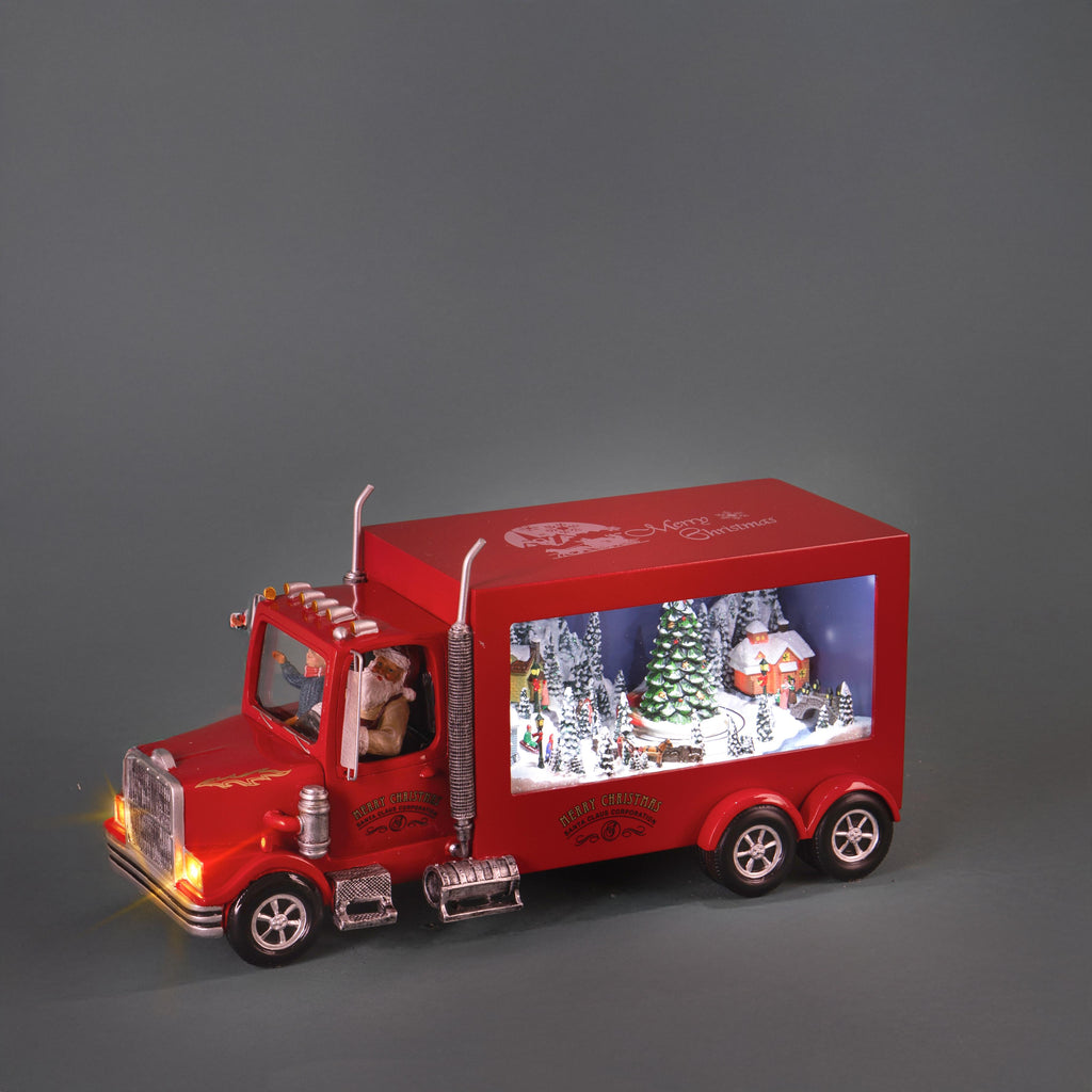 Camion natalizio musicale e luminoso con villaggio innevato