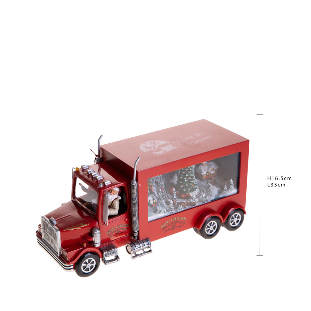 Camion natalizio musicale e luminoso con villaggio innevato